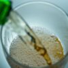 pouring alcohol into a cup