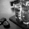shots of alcohol next to car key
