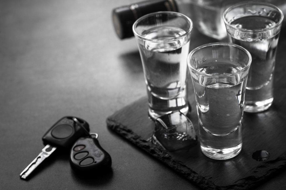 shots of alcohol next to car key