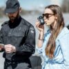 woman breathing into a breathalyser
