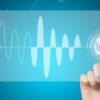 A finger presses a digital graphic, symbolising the advancement of customised breath analysis for personalised health monitoring.