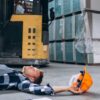 A worker faces an accident in a warehouse, highlighting the importance of preventing alcohol-induced accidents.