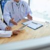 doctors discussing how to Improve Patient Outcomes