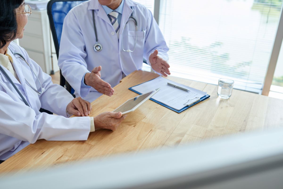 doctors discussing how to Improve Patient Outcomes