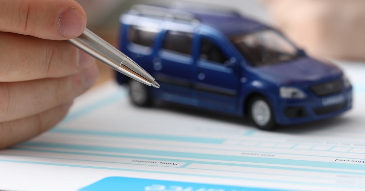 car on insurance document filling out form for insurance discounts on breathalysers