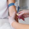 A nurse conducts a blood test as part of alcohol detection, highlighting the differences in accuracy between breathalysers vs blood tests.