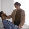 ill patient talking to his wife about post-surgery breathalyser