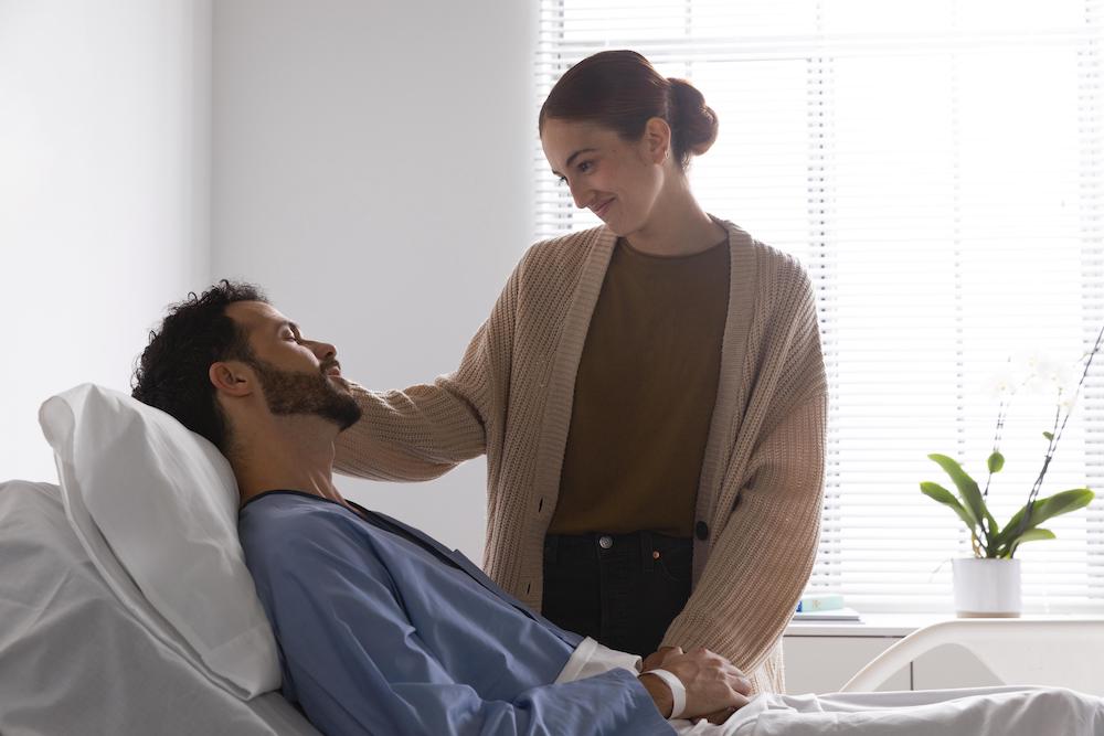 ill patient talking to his wife about post-surgery breathalyser