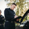 male police officer checks false positives in breathalyser